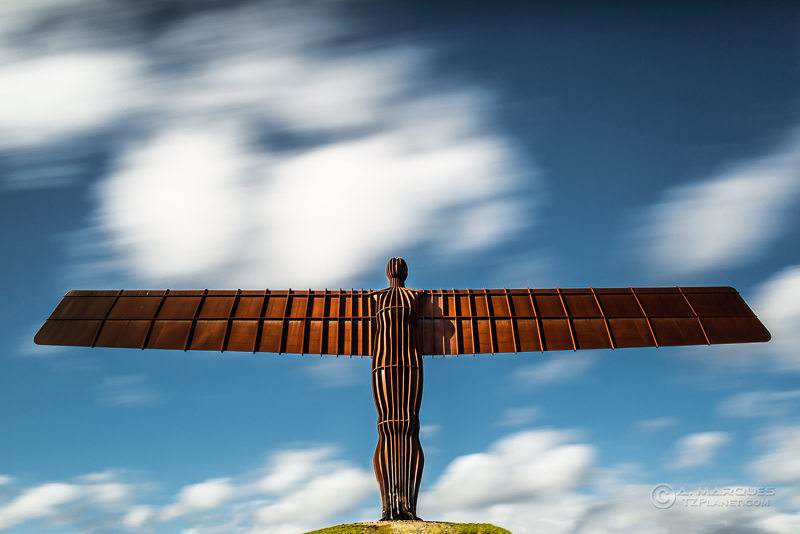 The Angel of the North is located in Gateshead, Northeast of England, UK.  The steel sculpture, Britain's largest, was commissioned to Turner prize-winning artist Antony Gormley by the Gateshead Council.  Standing at over 20m tall and 54m wingspan (wider than a Boing 757), the Angel of the North is one of England's most recognisable landmarks.